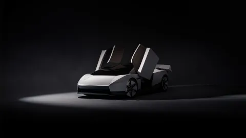 Přední tříčtvrteční pohled na novou Teslu Roadster v laku Ano White s otevřenými dveřmi a skrytými světlomety (Foto: Tesla)