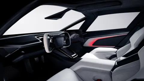 Dvoumístný interiér Ultrawhite nové Tesly Roadster s volantem yoke pro řízení steer-by-wire a centrálním displejem (Foto: Tesla)